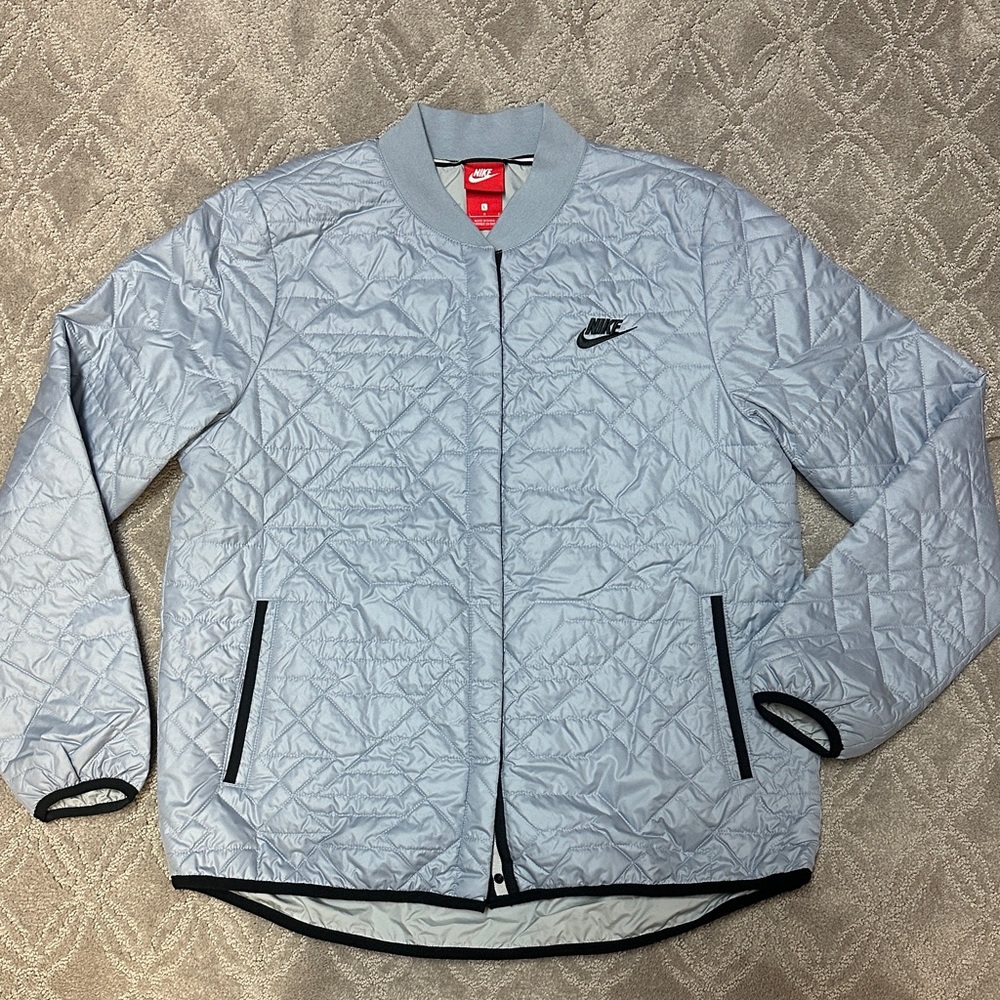Nike Periwinkle Blue Quilted Jacket with Black Details. Buttoned Closure. Size L